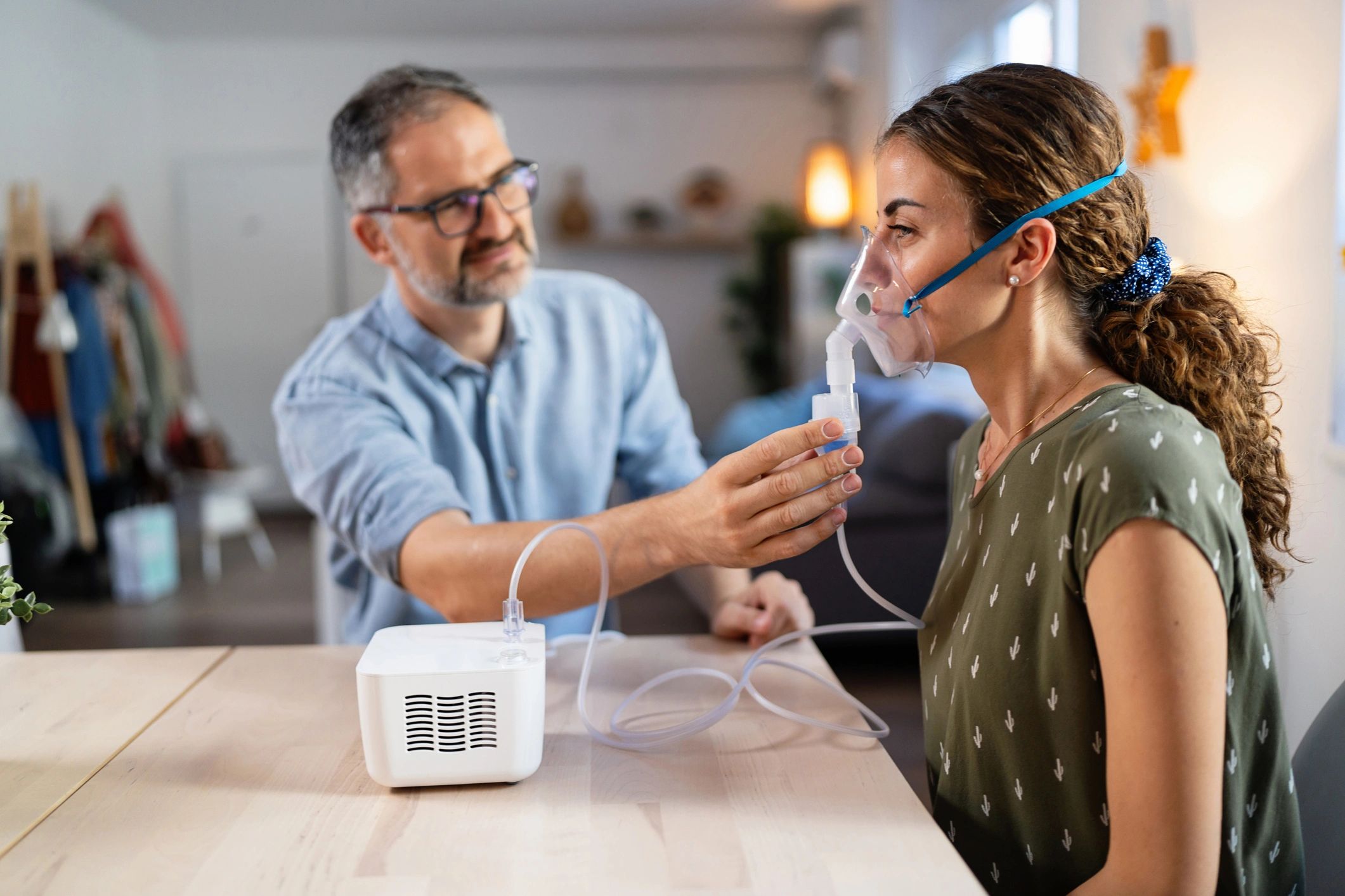 Doctor demonstrating nebulizer to patient