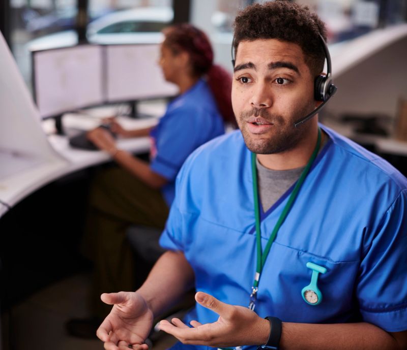 Healthcare professional with headset in call center