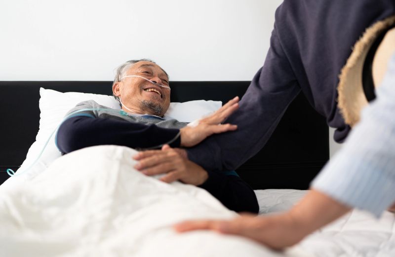 Elderly man with home oxygen therapy